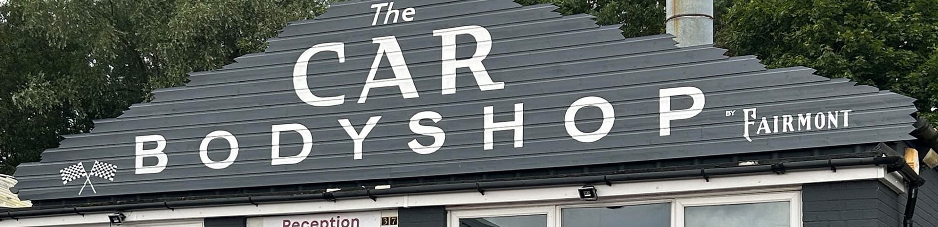 Bodyshop Banner (1) Cropped Top - Fairmont Sports and Classics