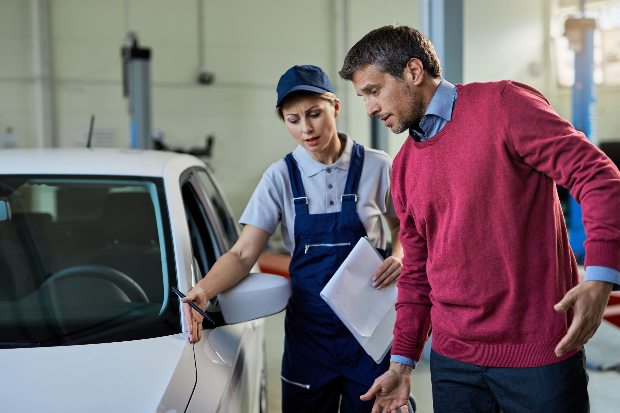Female Mechanic Car Owner Communicating About Vehicle Breakdown Auto Repair Shop (1) - Exeter Diesels